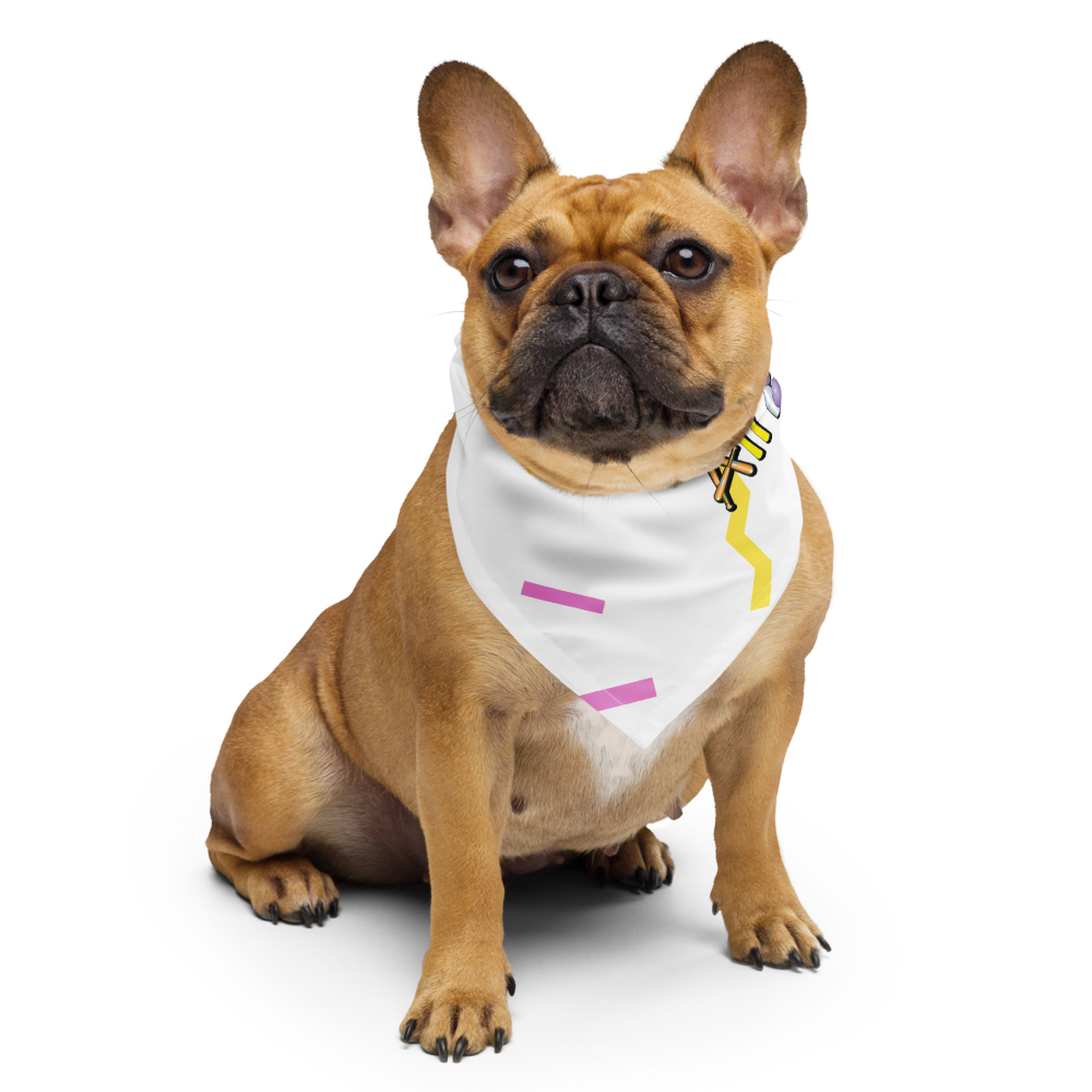 Brown dog wearing a white cutie l cotton bandana with colorful designs