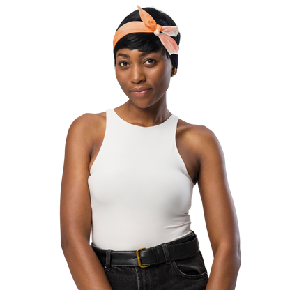 Woman earing an orange headband on a white background