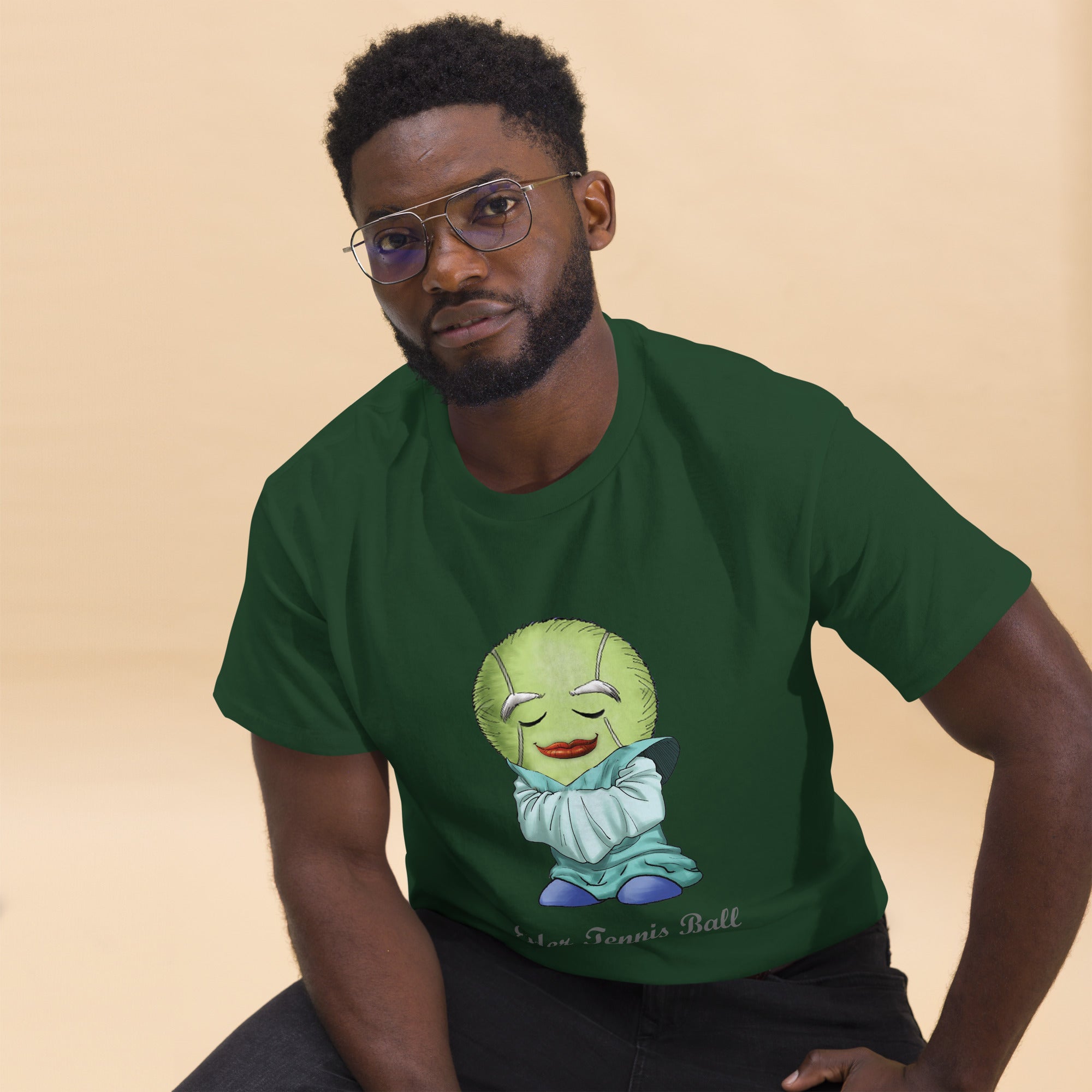 Man wearing a green t-shirt with a Tennis Ball cartoon character print 