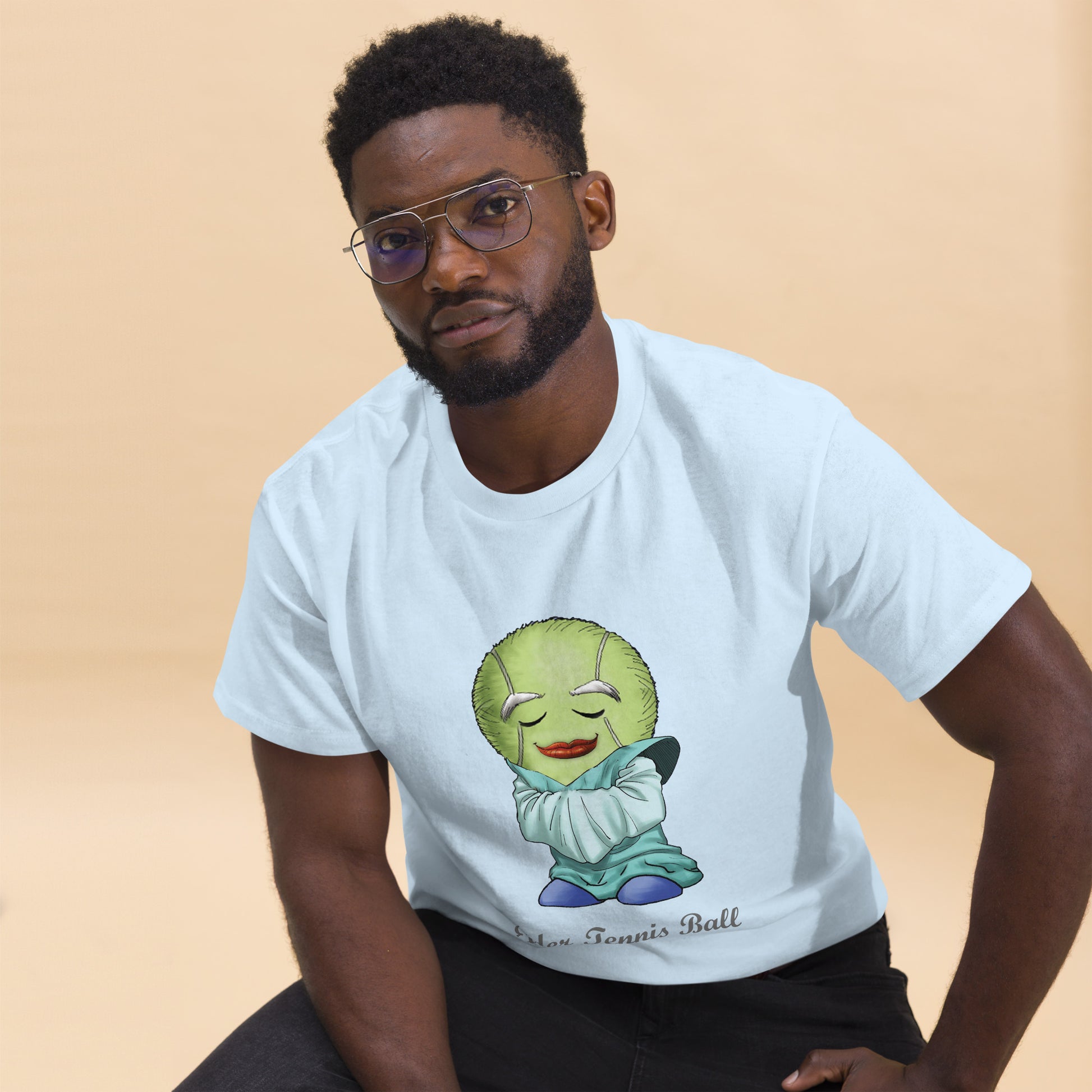 Man wearing a white t-shirt with a Tennis Ball cartoon character print 