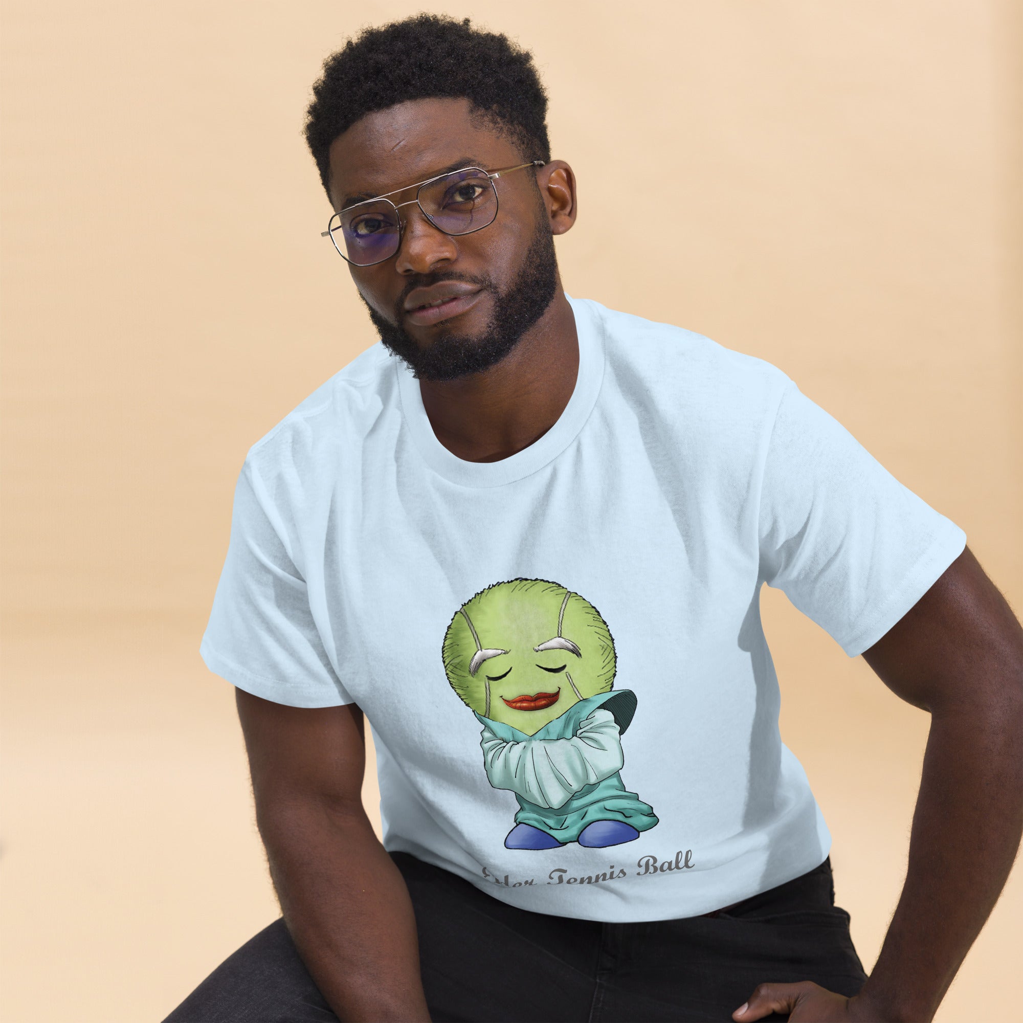 Man wearing a white t-shirt with a Tennis Ball cartoon character print 
