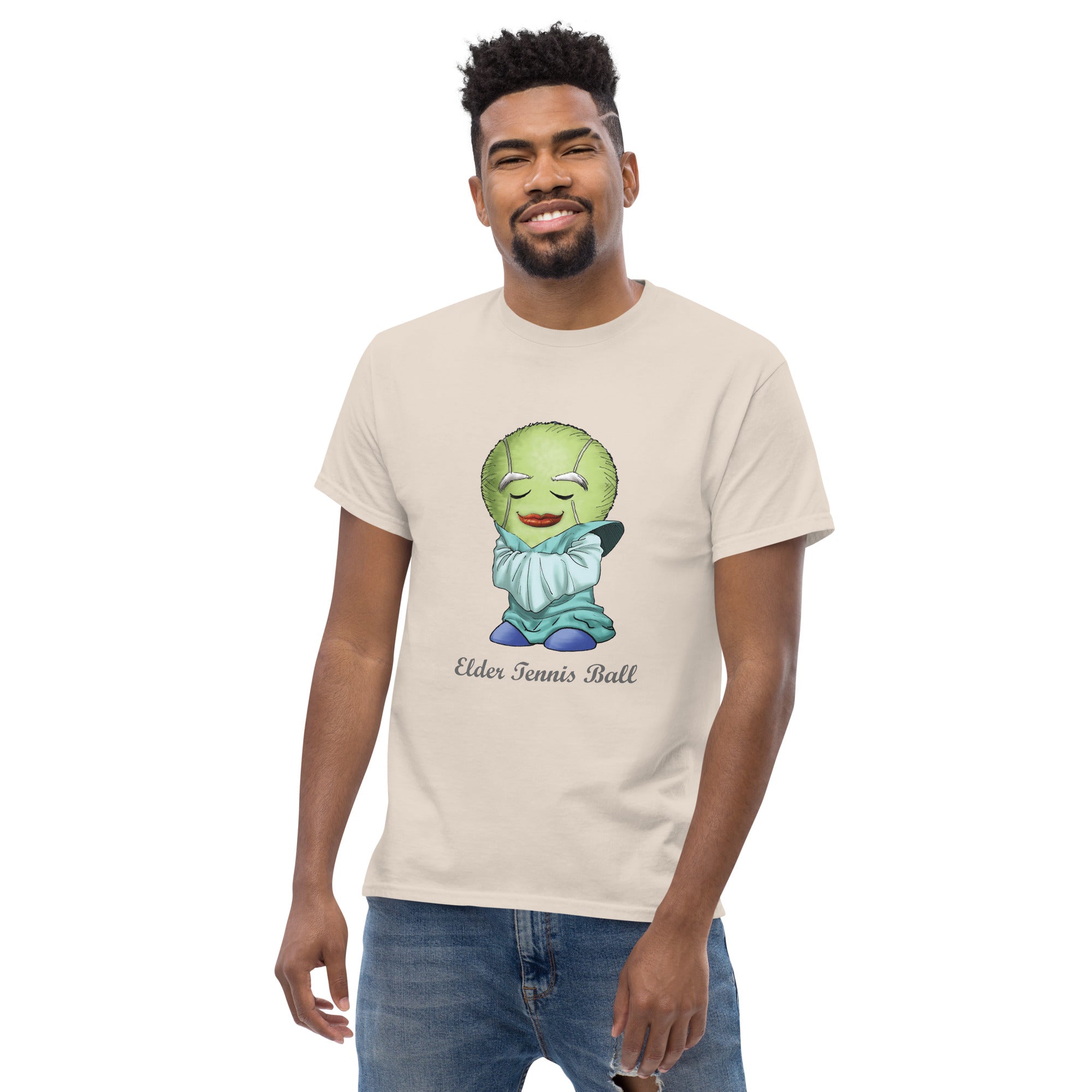 Man wearing a beige t-shirt with a Tennis Ball cartoon character print 